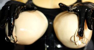 Rubber Tits invite you to explore a free pics with enchanting maiden in femdom porn